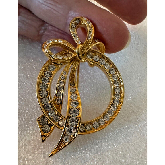Vintage NOLAN MILLER Circle Pin Gold Tone Bow Clear Rhinestones Wedding 2" - Picture 1 of 5